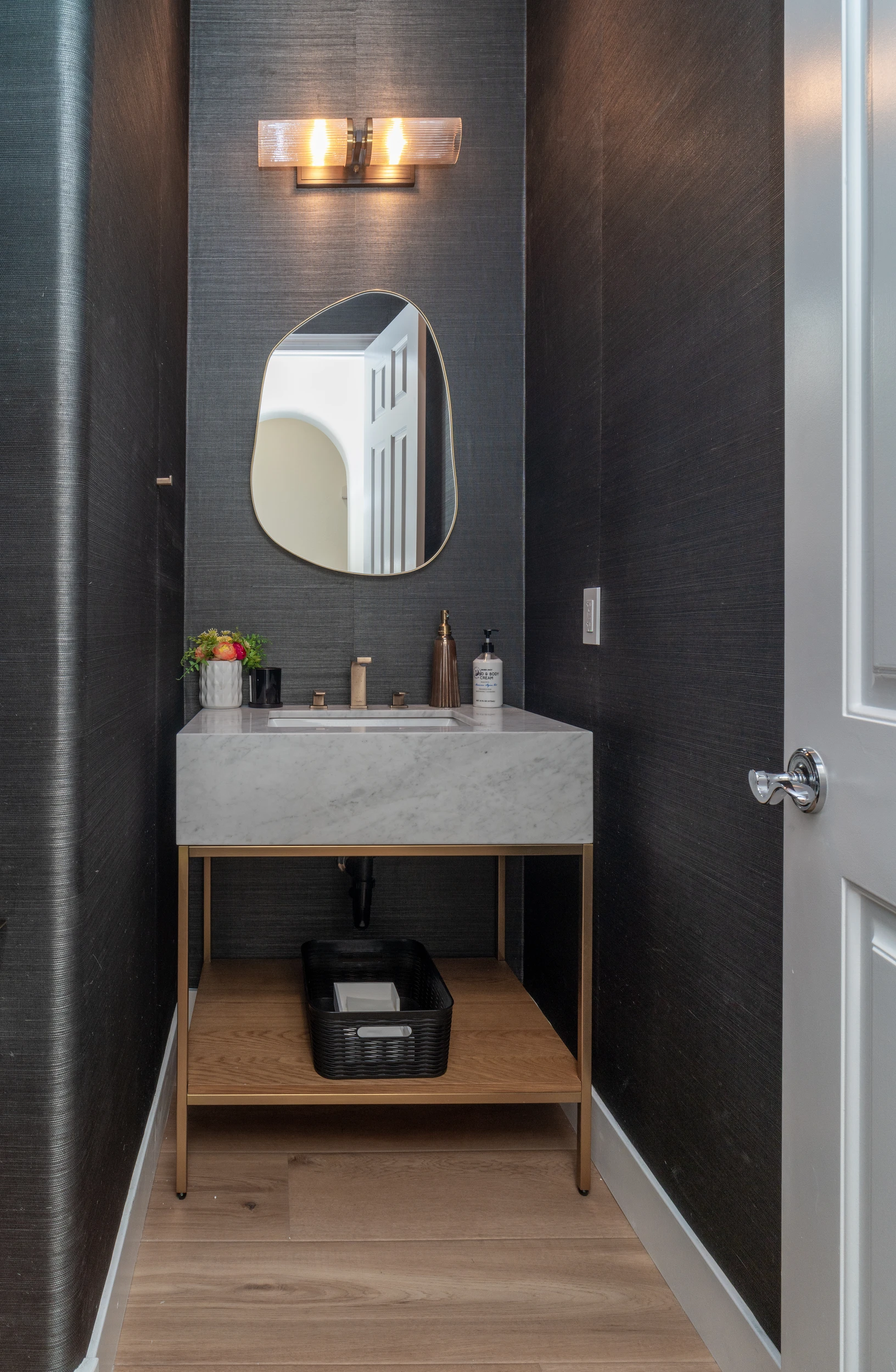 Powder room with grasscloth wallpaper