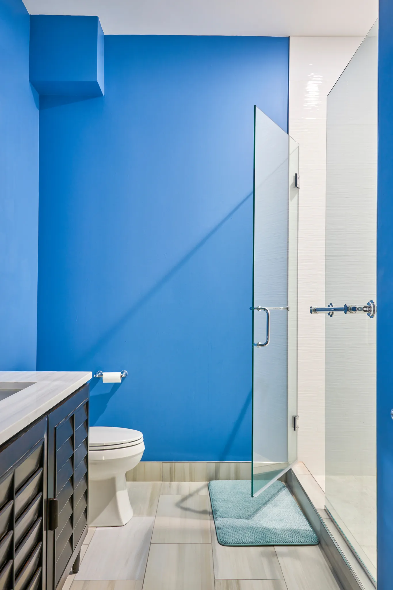 Sky-blue bath with walk-in shower