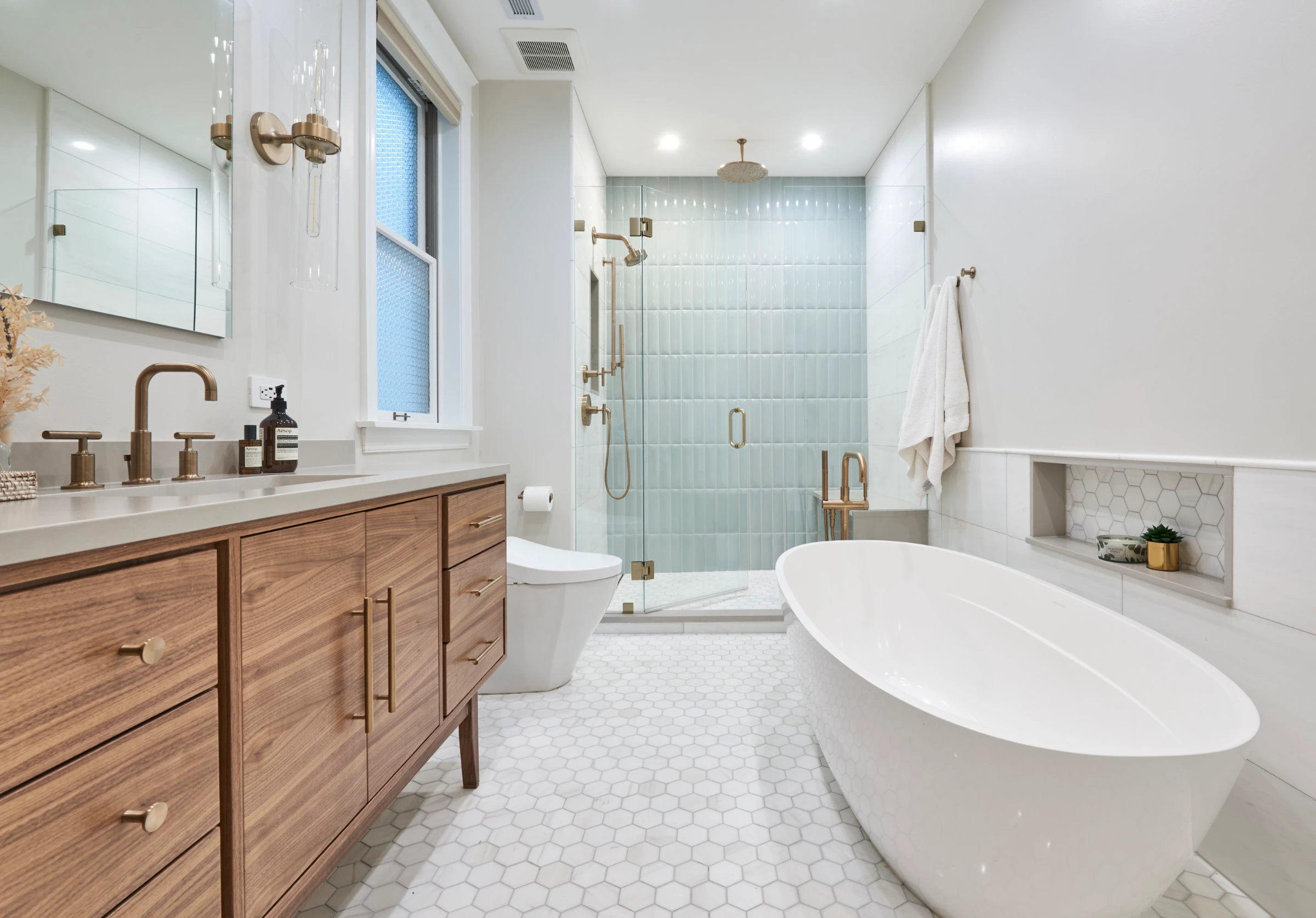 Upscale beautiful bathroom remodel with walk-in shower and freestanding tub