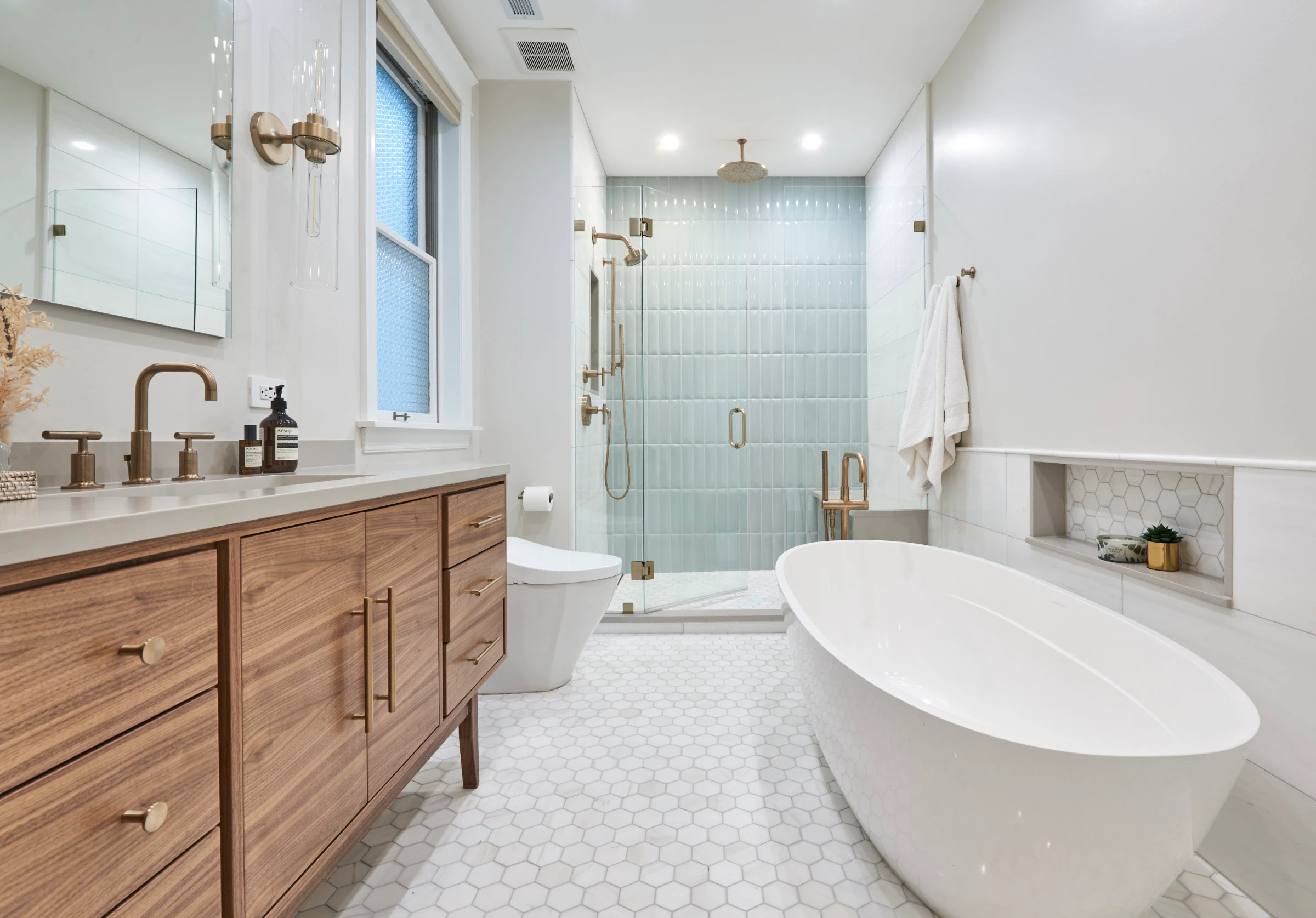 bright modern bathroom with freestanding tub and walk-in shower